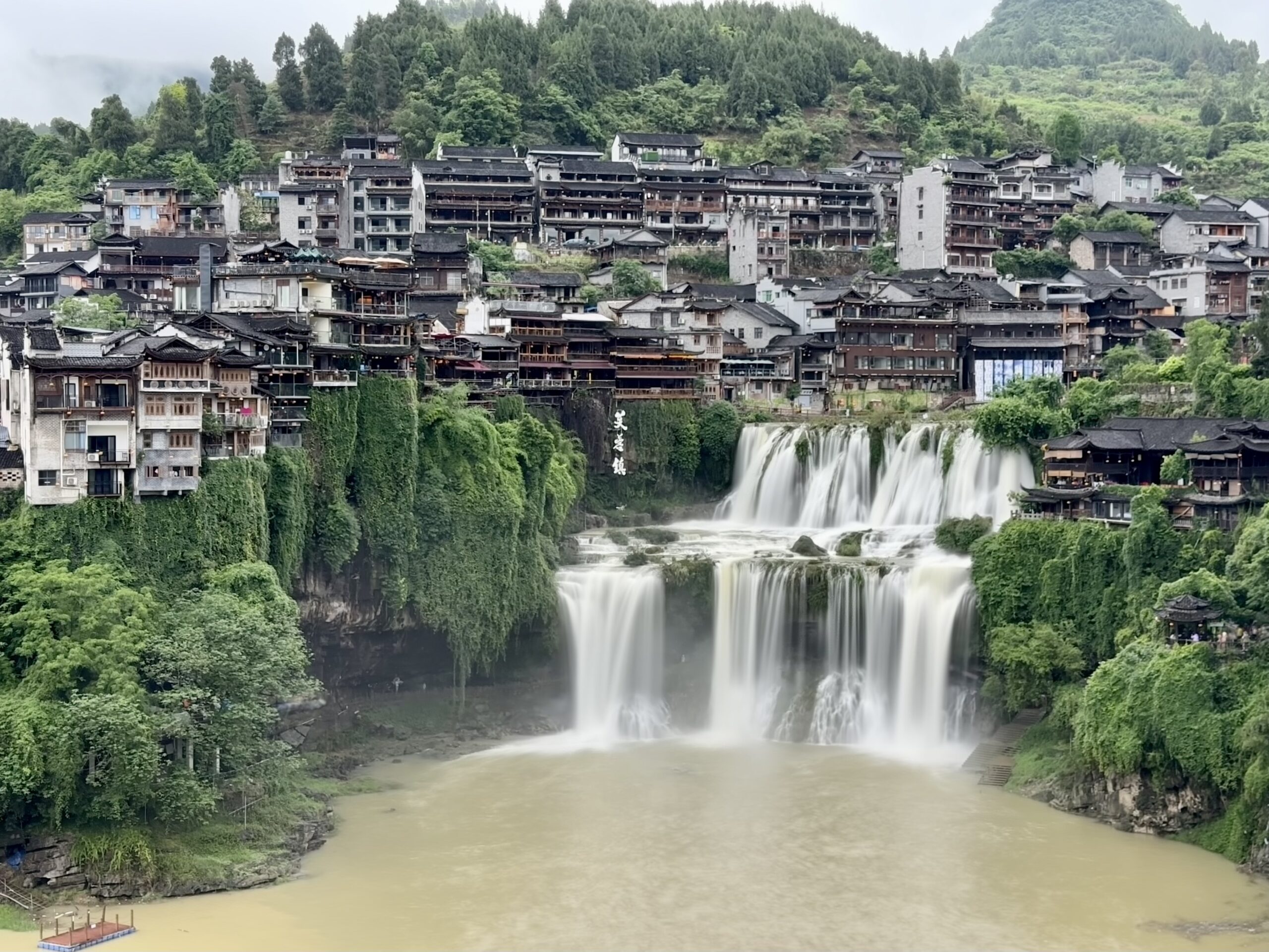 Multi-level waterfall flowing through Furong Town in China